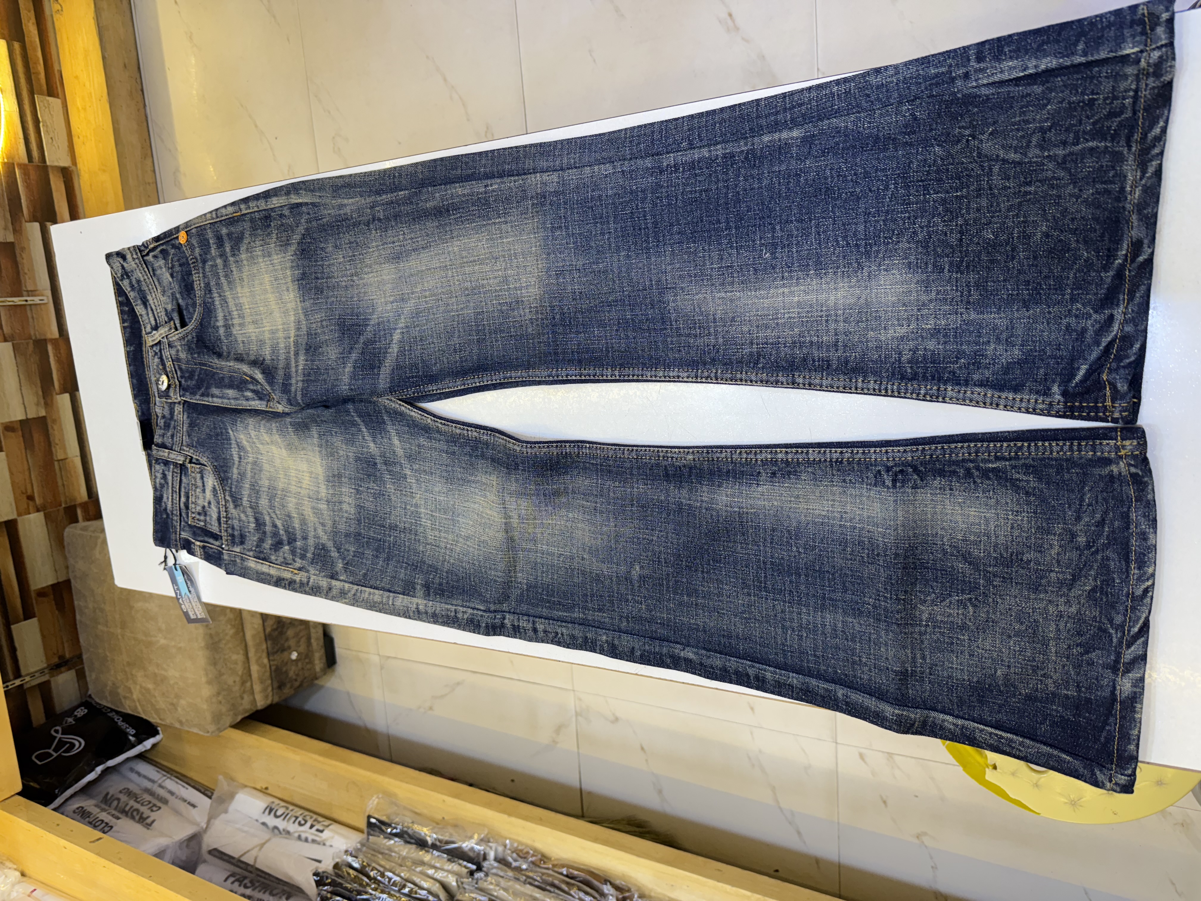 Black and yellowish gold shade jeans